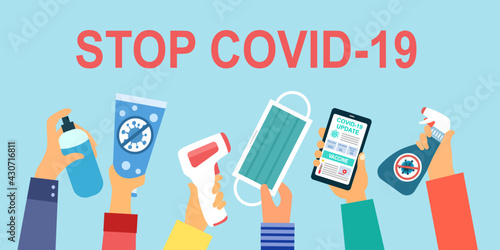 Hand holding alcohol, hand sanitizer, face mask, infrared thermometer, virus disinfection spray and smartphone in flat design. Stop covid19 coronavirus concept. Health protection.