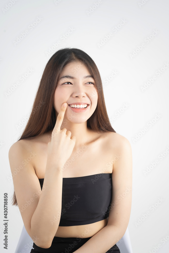 Portrait of beautiful asian woman makeup of cosmetic, girl hand touch cheek and smile attractive, face of beauty perfect with wellness isolated on white background with skin healthcare concept. Portrait of beautiful asian woman makeup of cosmetic, girl hand touch cheek and smile attractive, face of beauty perfect with wellness isolated on white background with skin healthcare concept.