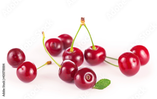 Ripe fresh red cherry isolated on white background.