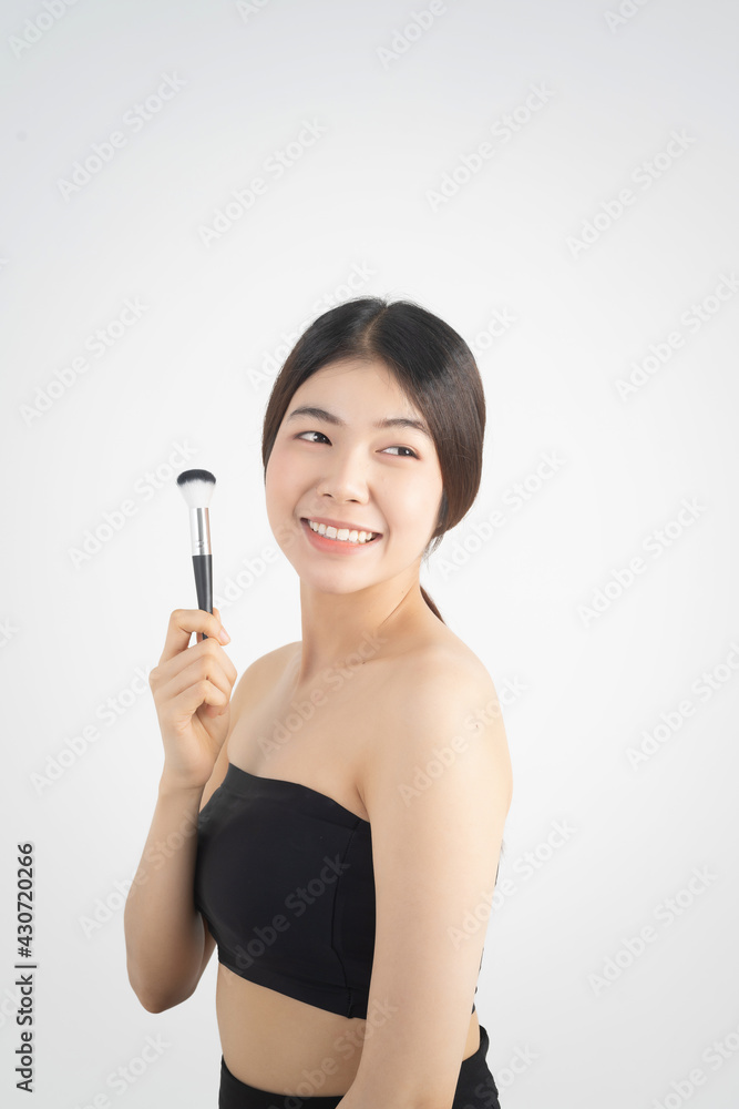 Portrait of beautiful asian woman makeup of cosmetic, girl hand touch cheek and smile attractive, face of beauty perfect with wellness isolated on white background with skin healthcare concept. Portrait of beautiful asian woman makeup of cosmetic, girl hand touch cheek and smile attractive, face of beauty perfect with wellness isolated on white background with skin healthcare concept.