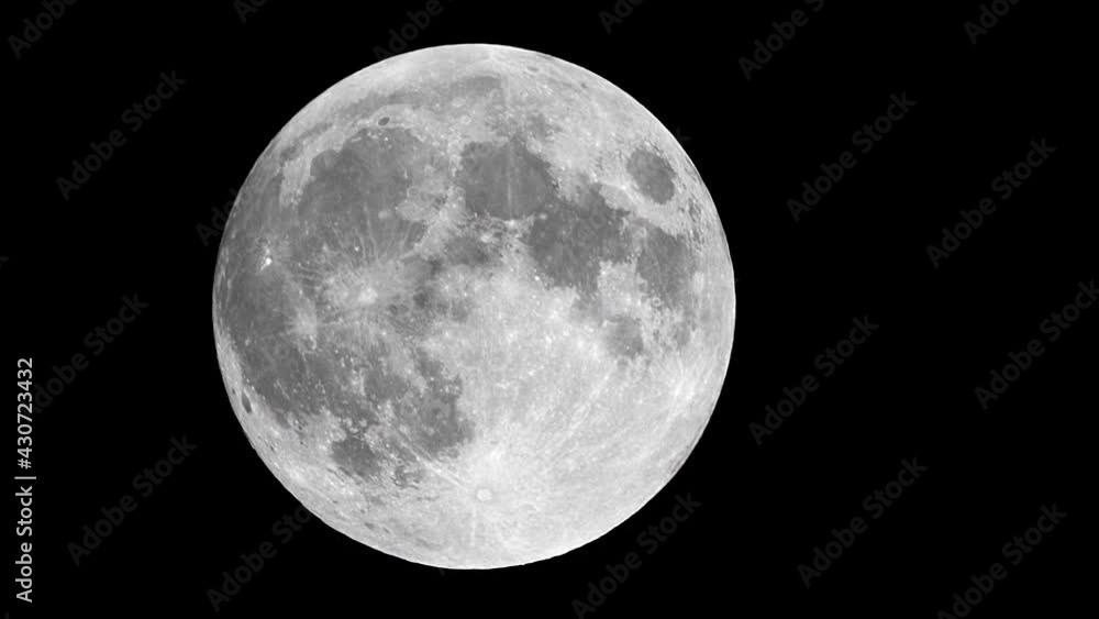 Supermoon moving across the night sky. Supermoon moving across the night sky.