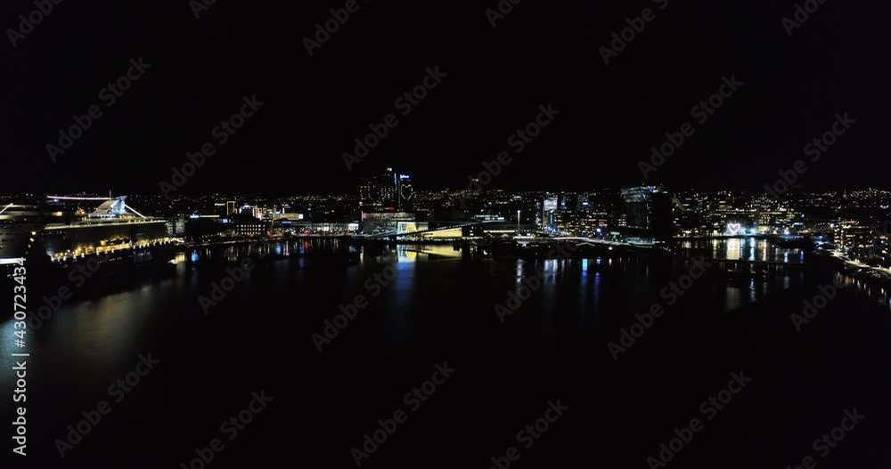 Drone crane move Oslo panorama view to illuminated Opera House at night Drone crane move Oslo panorama view to illuminated Opera House at night