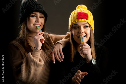 Portrait of two young pretty smiling girls photo