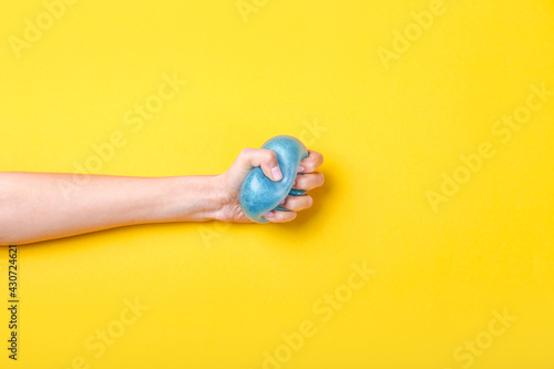 Female hand squeezing stres...