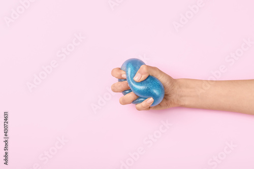 Female hand squeezing stres...