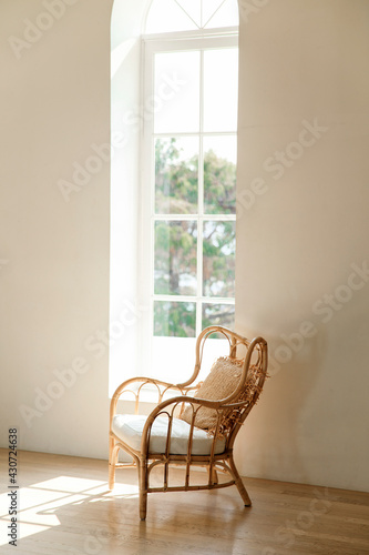 Vintage chairs are standing near a wall of the sun s rays and the shadows.