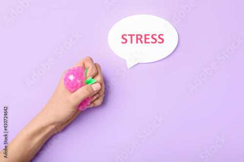 Female hand squeezing stres...
