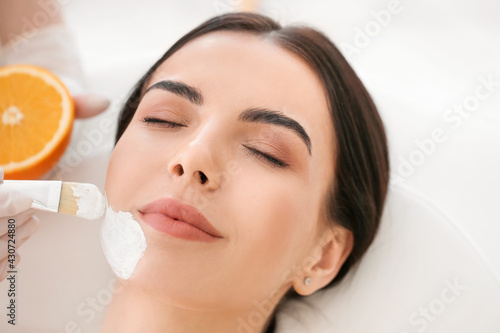 Cosmetologist applying mask...