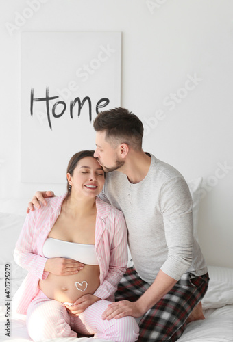 Beautiful pregnant couple a...