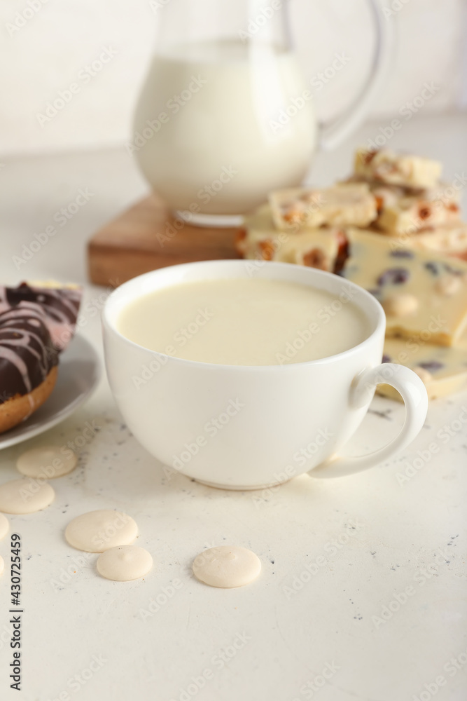 Cup with hot white chocolate on light background Cup with hot white chocolate on light background