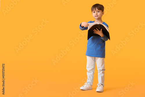 Little boy with Bible on co...