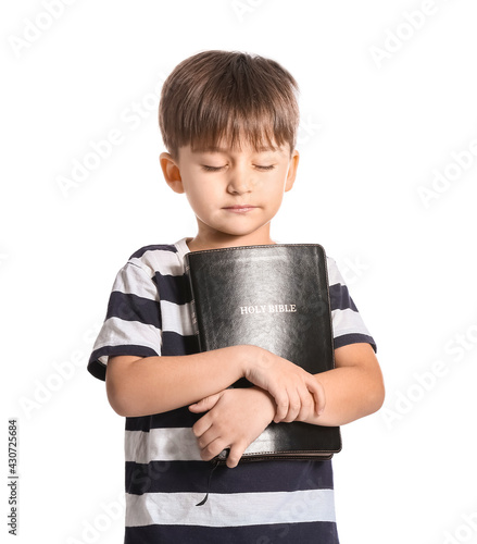 Little boy with Bible on wh...