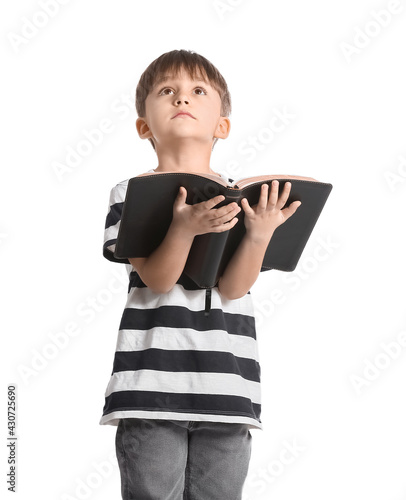 Little boy with Bible on wh...