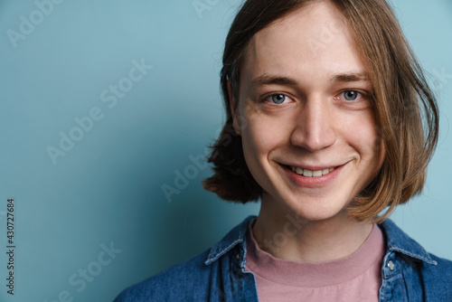Young european man smiling and looking at camera
