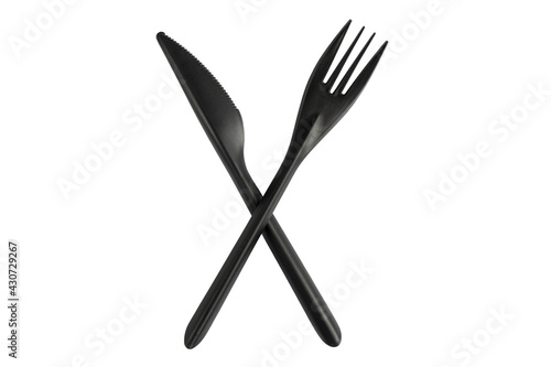 Black plastic knife and fork isolated on white background. Disposable tableware set isolated with clipping path.