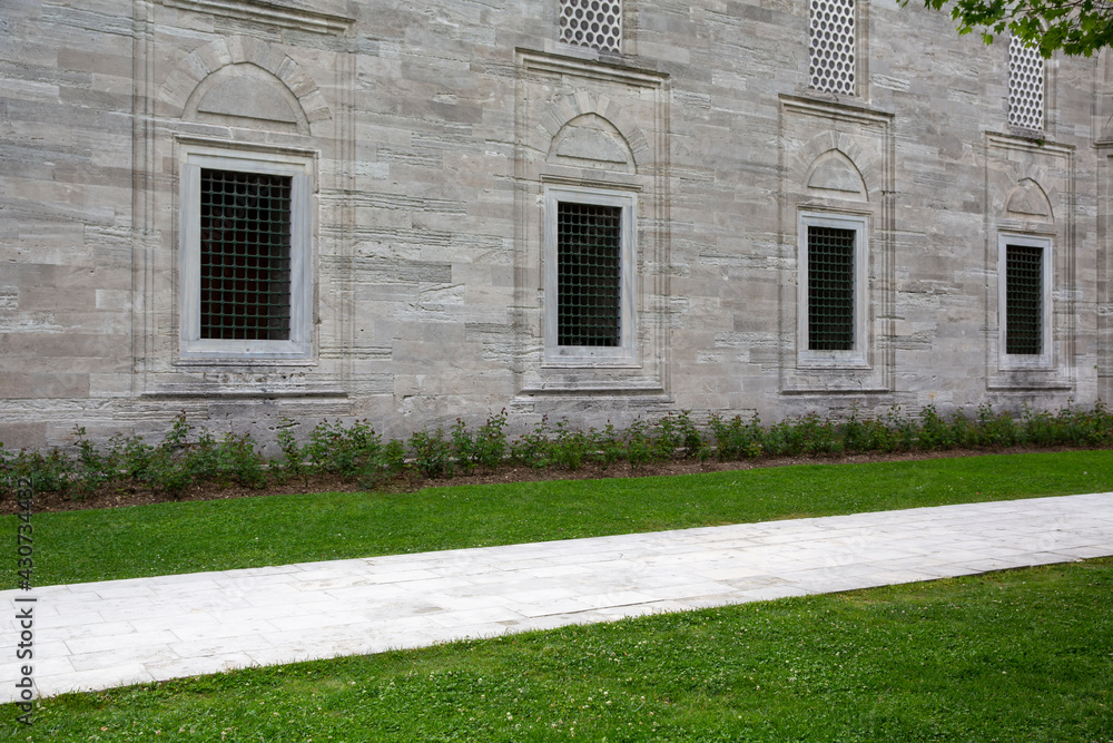 empty historic building garden, grassy floor and stone walls empty historic building garden, grassy floor and stone walls