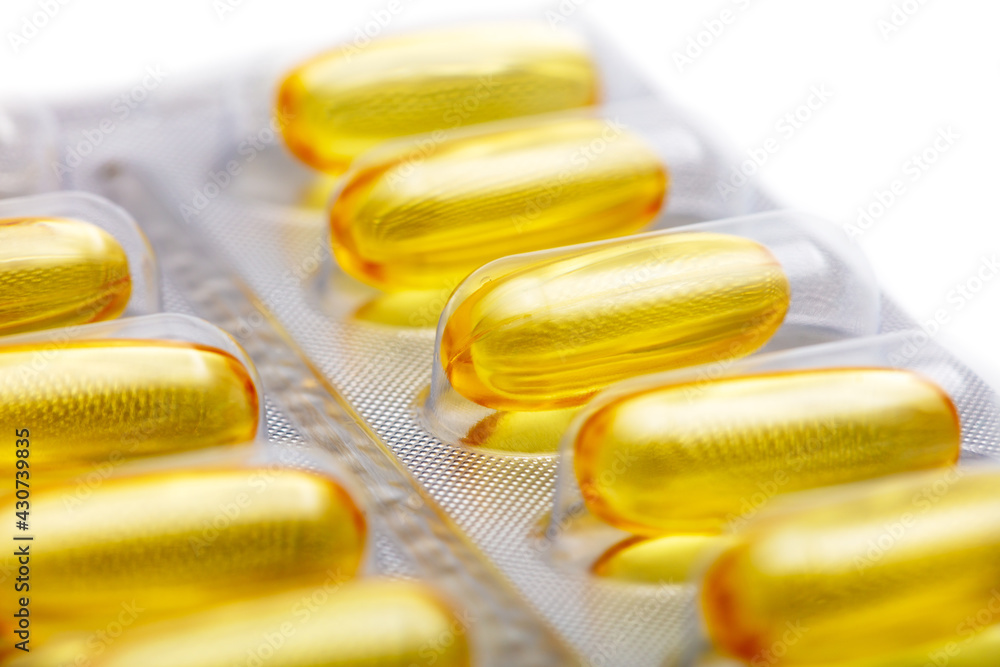 Yellow transparent pills of fish oil Yellow transparent pills of fish oil