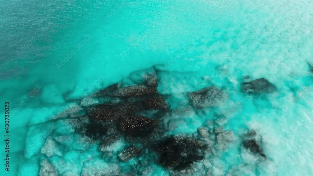 Aerial surfers catching a wave, Esperance in crystal clear blue water. Australia Aerial surfers catching a wave, Esperance in crystal clear blue water. Australia