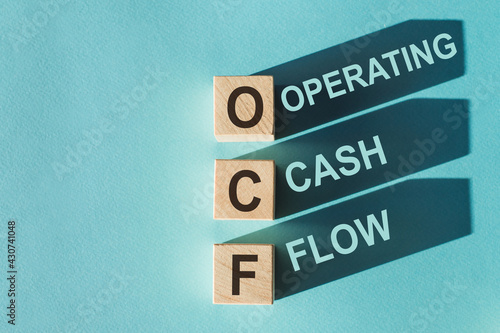 Text OCF on wooden cube blocks, stock concept. OCF - this is cash that comes from the operating activities of the company