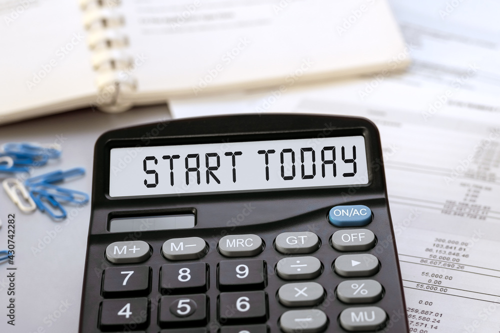 START TODAY - concept of text on calculator display START TODAY - concept of text on calculator display
