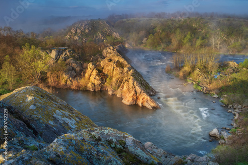 silent morning in river canyon with first sun rays and fog © sergejson