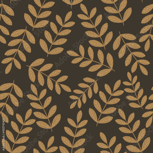 Seamless floral pattern with branches with hand drawn leaves on a brown background for textiles, paper, clothes, cards, souvenirs