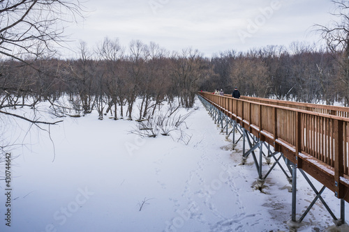 Fototapeta Naklejka Na Ścianę i Meble -  The footbridge of the Parc Écomaritime de l'Anse-du-Port, a small park near the St Lawrence river in Nicolet, Quebec (Canada)