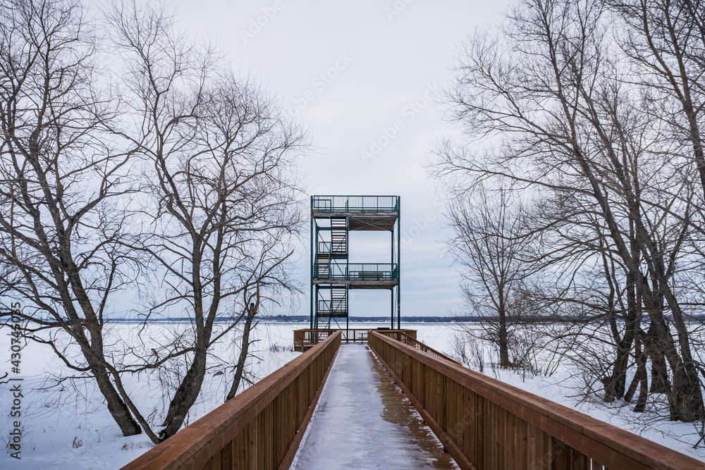 The footbridge of the Parc Écomaritime de l'Anse-du-Port, a small park near the St Lawrence river in Nicolet, Quebec (Canada) The footbridge of the Parc Écomaritime de l'Anse-du-Port, a small park near the St Lawrence river in Nicolet, Quebec (Canada)