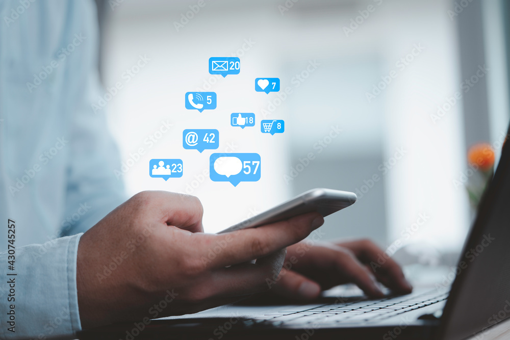 Man holding smartphone with Social media and business icons , technology and marketing concept. Man holding smartphone with Social media and business icons , technology and marketing concept.