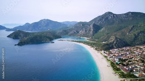 Amazing high angle top drone view on world famous paragliding and parasailing turkish spot for extrim parachute sport in Oludeniz in Fethiye, Turkey
