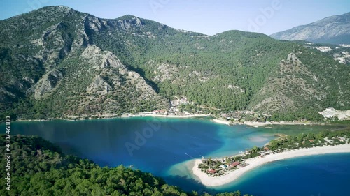 Amazing high angle top drone view on world famous paragliding and parasailing turkish spot for extrim parachute sport in Oludeniz in Fethiye, Turkey
