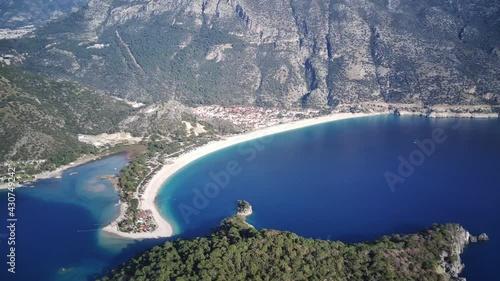 Amazing high angle top drone view on world famous paragliding and parasailing turkish spot for extrim parachute sport in Oludeniz in Fethiye, Turkey
