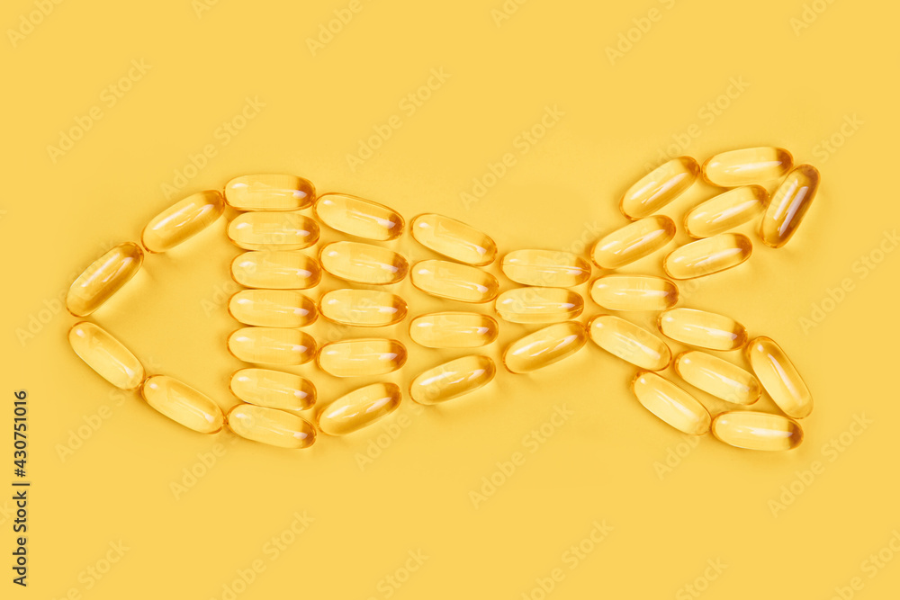 Omega 3 capsules.Vitamin drop pill capsule. Shining golden essence droplet. fish from capsules Omega 3 capsules.Vitamin drop pill capsule. Shining golden essence droplet. fish from capsules