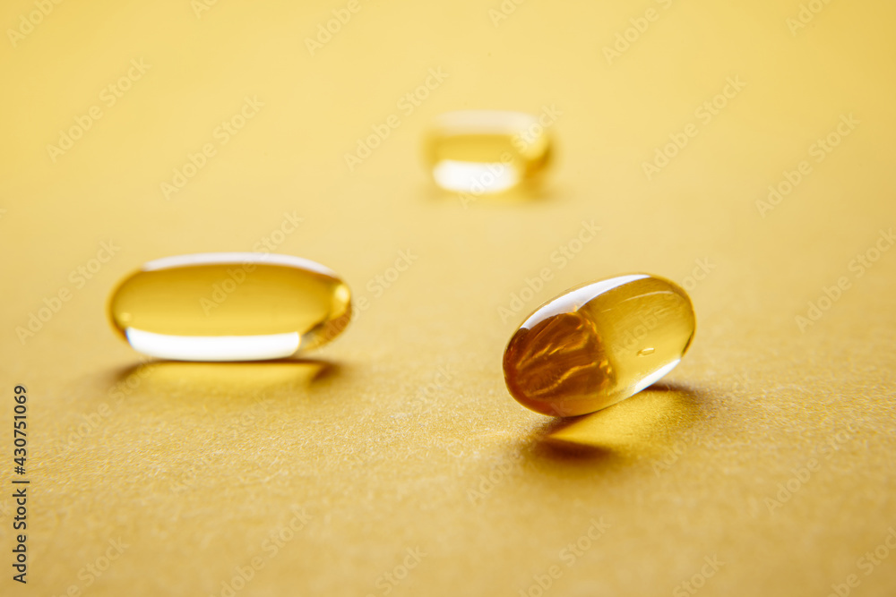 Omega 3 capsules.Vitamin drop pill capsule. Shining golden essence droplet. Omega 3 capsules.Vitamin drop pill capsule. Shining golden essence droplet.