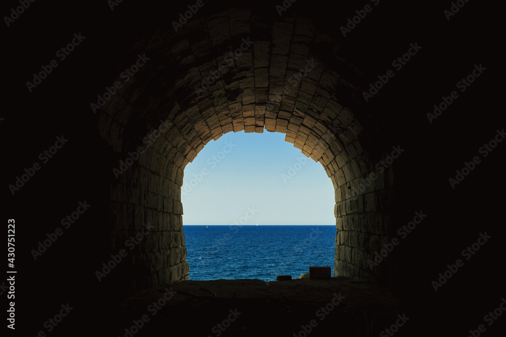 End of the tunnel with sea view