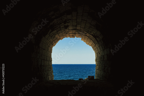 End of the tunnel with sea view