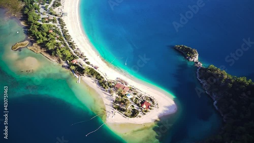 Amazing high angle top drone view on world famous paragliding and parasailing turkish spot for extrim parachute sport in Oludeniz in Fethiye, Turkey
