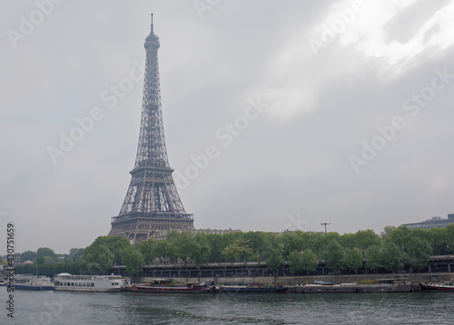 View of the Port de Suffren and the Eiffel Tower. In the port there are ships and cars © Aleksandr