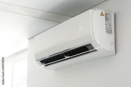 A new air conditioner unit on the white wall