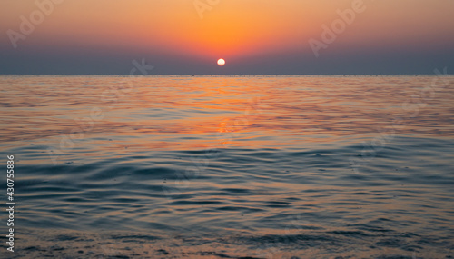 Colorful vibrant ocean beach sunrise during a summer day. beautiful sunrise