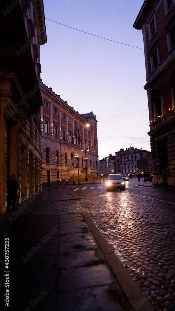 Evening or night view of old cozy street in Rome, Italy. Cityscape of italian capital with nobody.