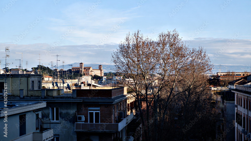 Rome, Italy, bird view to the side of Capitol Hill with roofs and churches of the ancient city on the bright day