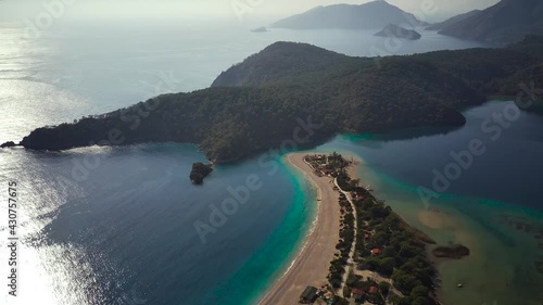 Amazing high angle top drone view on world famous paragliding and parasailing turkish spot for extrim parachute sport in Oludeniz in Fethiye, Turkey
