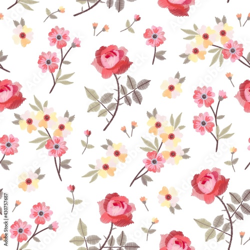 Embroidery seamless pattern with beautiful garden flowers on white background. Vector seamless pattern.