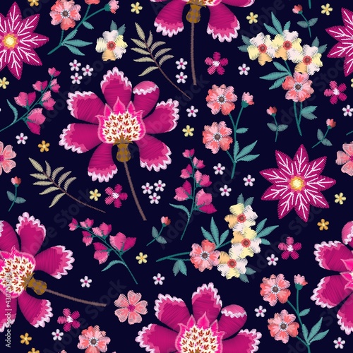 Embroidery seamless pattern with beautiful flowers. Vector floral ornament with fantasy motifs.