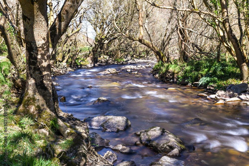 Rushing clear river water splashes over rocks Rushing clear river water splashes over rocks