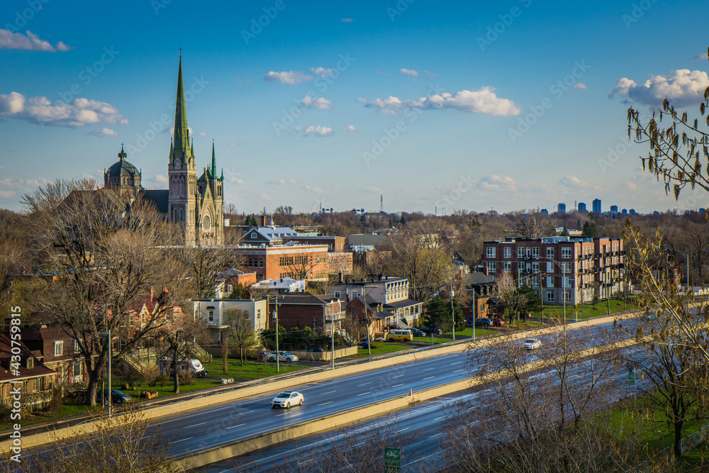 Naklejka premium View on the historic center of Longueuil (Quebec, Canada) and the cathedral from the observation tower in Marie Victorin park