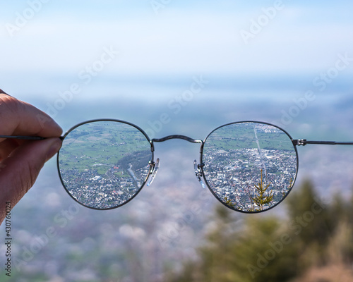 myopic looks through his glasses