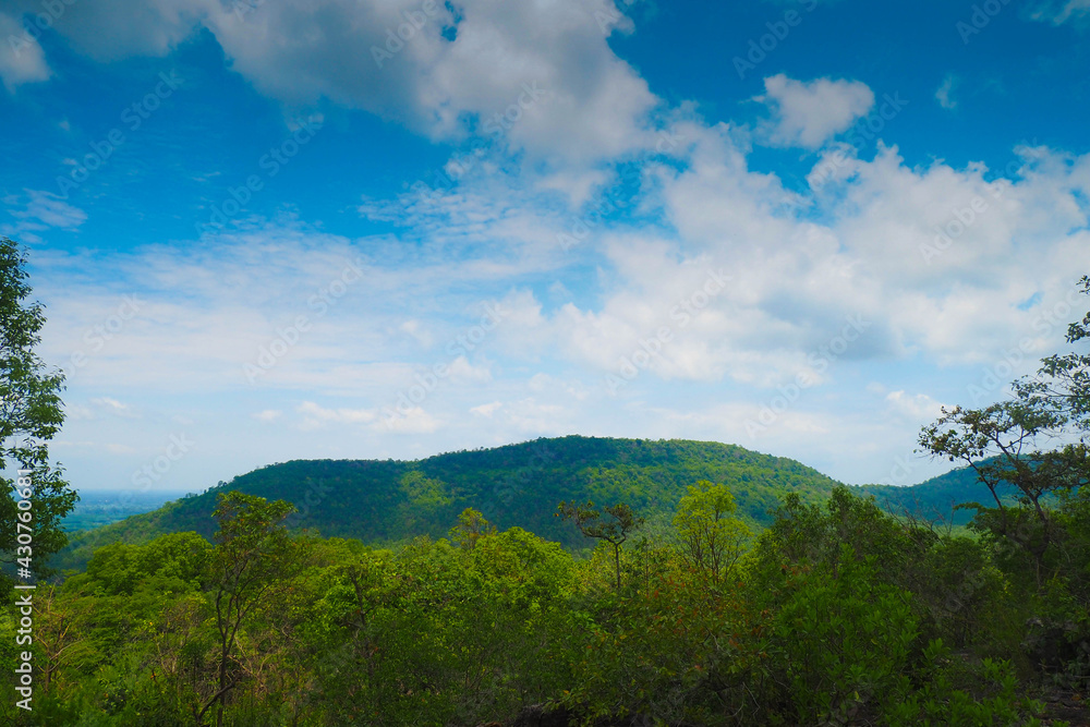 landscape view with blue sky or black sky, mountain ,green forest and rock 