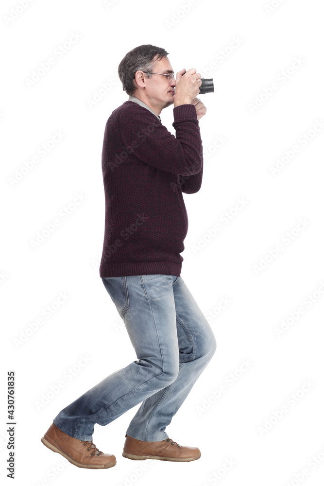 full-length.casual man with a camera. isolated on a white full-length.casual man with a camera. isolated on a white